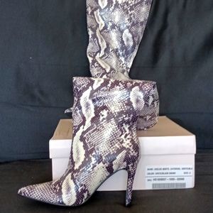 Heeled snakeskin boots